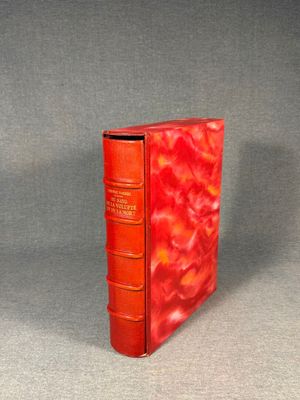 a red book that is sitting on a table