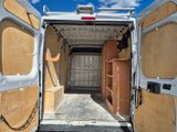 a white van that is open with the door open