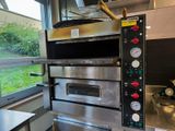an image of a commercial oven in a commercial kitchen