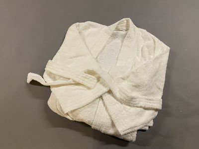 towel wrapped in a white towel on a gray surface