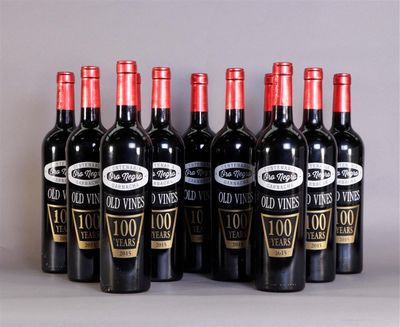 six bottles of wine are lined up in a row on a table