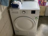 a washer and a dryer in a small room