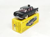 a black toy car sitting on top of a yellow box