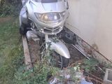 a motorcycle that is parked next to a house