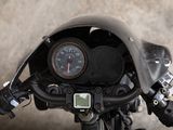 a close up of a motorcycle with a speedometer on it ' s handlebar