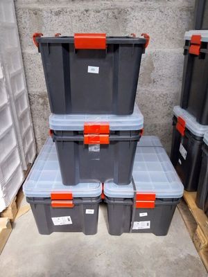 many plastic boxes stacked on top of each other in a warehouse
