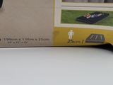 the box is open to show the contents of the toy car