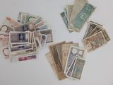 many different types of currency laid out on the table