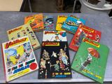 several children ' s books are sitting on a table in a room
