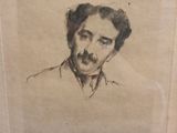 une vieille photo d'un homme avec une moustache et une moustache