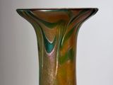 a glass vase that is sitting on a table