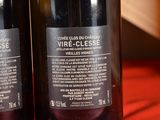 two bottles of wine that are on a table