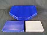 two blue and white boxes sitting next to each other on a table