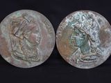 pair of ancient roman bronze coins depicting a woman and a man