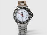 a close up of a watch on a white background