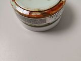 a white bowl with a lid on a table