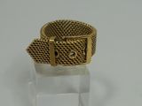 an image of a gold bracelet with a square clasp on it