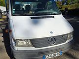 a white van that is parked on the side of the road