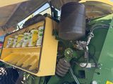 a tractor that has some cans of soda in it