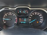 a close up of a car dashboard with a speedometer and gauges
