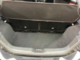 a trunk of a car with luggage in it