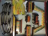 a box with a bunch of toy trains in it
