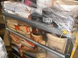 a cart with a lot of food in it in a warehouse