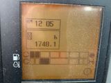 a close up of a car ' s dashboard with a clock on it