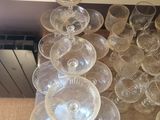 a lot of empty wine glasses sitting on a table