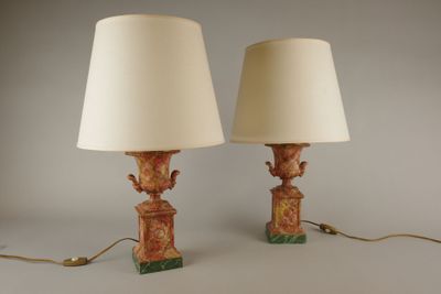 pair of lamps on a table with a lamp shade on top of them