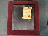 a picture of a glass frame with a certificate on it