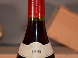 a bottle of wine that is sitting on a table