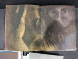an open book with a picture of a woman on it