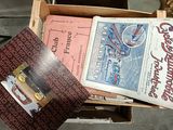 a lot of books in a box on the floor