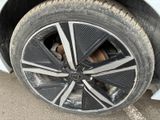 a close up of a tire on a car ' s rim
