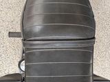 a close up of a motorcycle with a seat on it