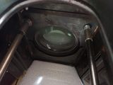 a toilet in the middle of a metal structure