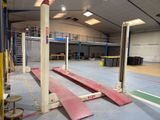 a picture of a gym with a lot of equipment on the floor