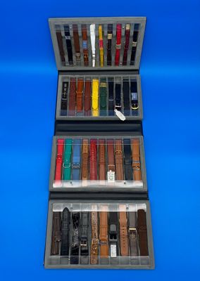 une vitrine contenant plusieurs types de montres