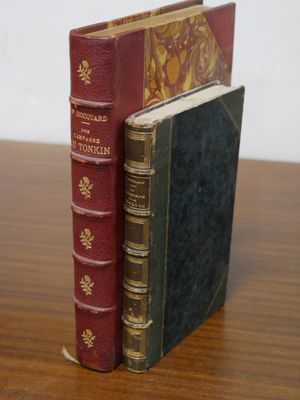 two books that are sitting on top of a wooden table