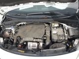 the engine of a car with its hood open and the hood up