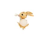 an image of a broochle of a rabbit with a ball in its mouth