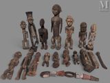 a lot of wooden figurines that are sitting on a table
