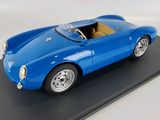 a model of a blue sports car on a black surface