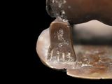 a close up of a statue of a horse that is melting