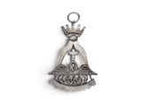 an image of a silver pendant with a crown on top of it