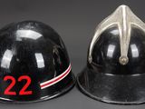 two black fire helmets with numbers 22 and 22 on them