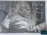a black and white photo of an old man in a suit