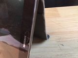 a tablet that is sitting on a wooden table
