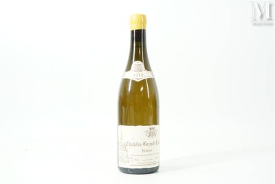 a bottle of wine that is sitting on a table
